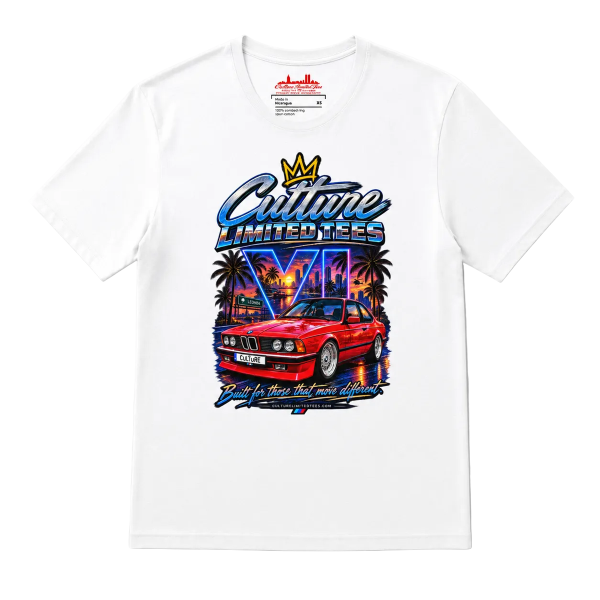 A white short-sleeve t-shirt with a colorful graphic print on the front. The graphic features a red classic car, palm trees, a neon cityscape, and stylized text reading 'Culture Limited Tees' with a crown above it.