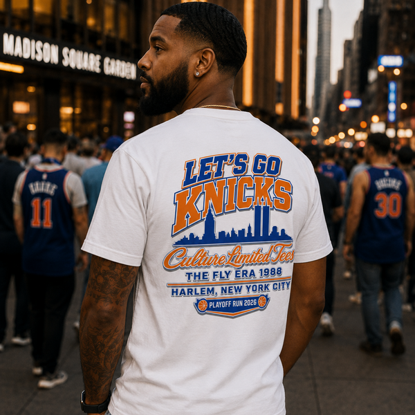 Man wearing a 'Let's Go Knicks' t-shirt in a crowded urban setting