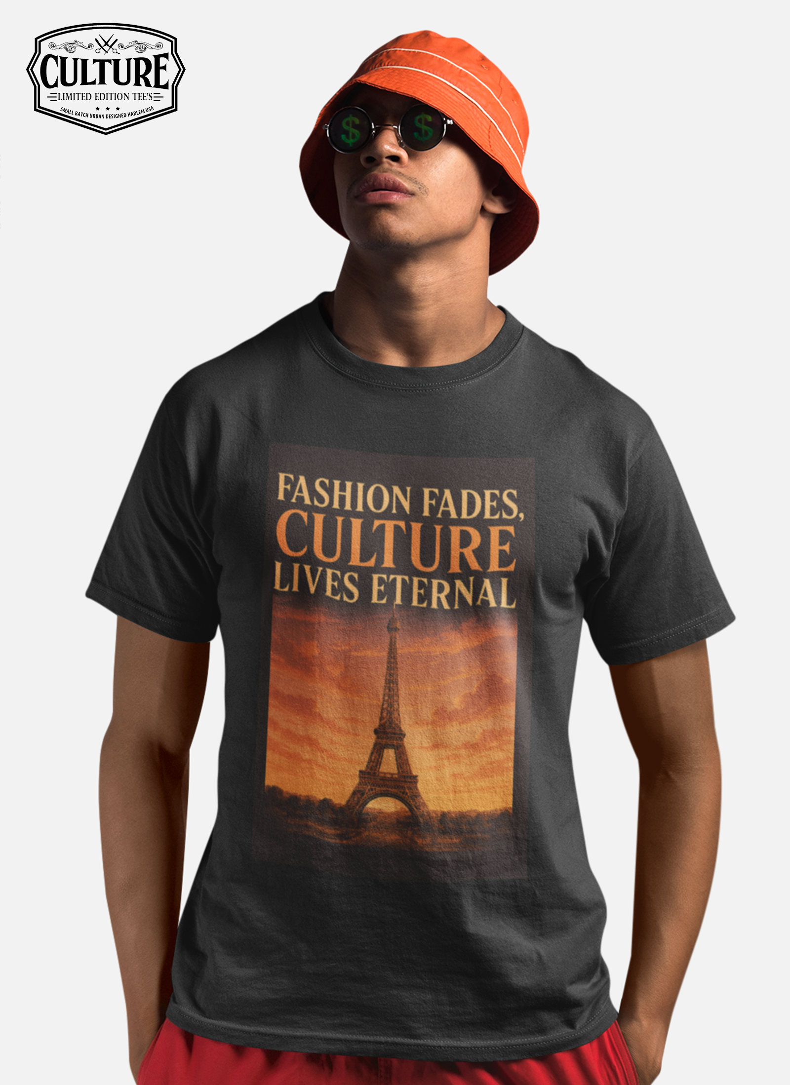 Person wearing a black t-shirt with a graphic design and text, standing against a plain background.